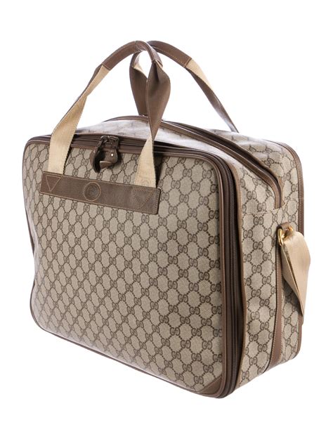 gucci carry on luggage.